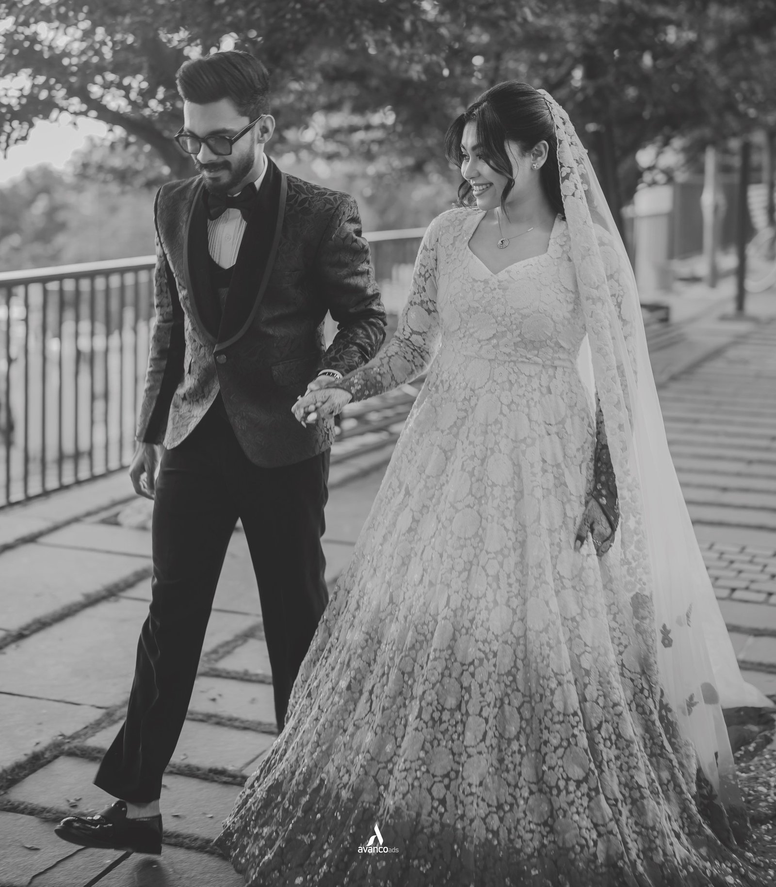 A bride and groom walking hand in hand