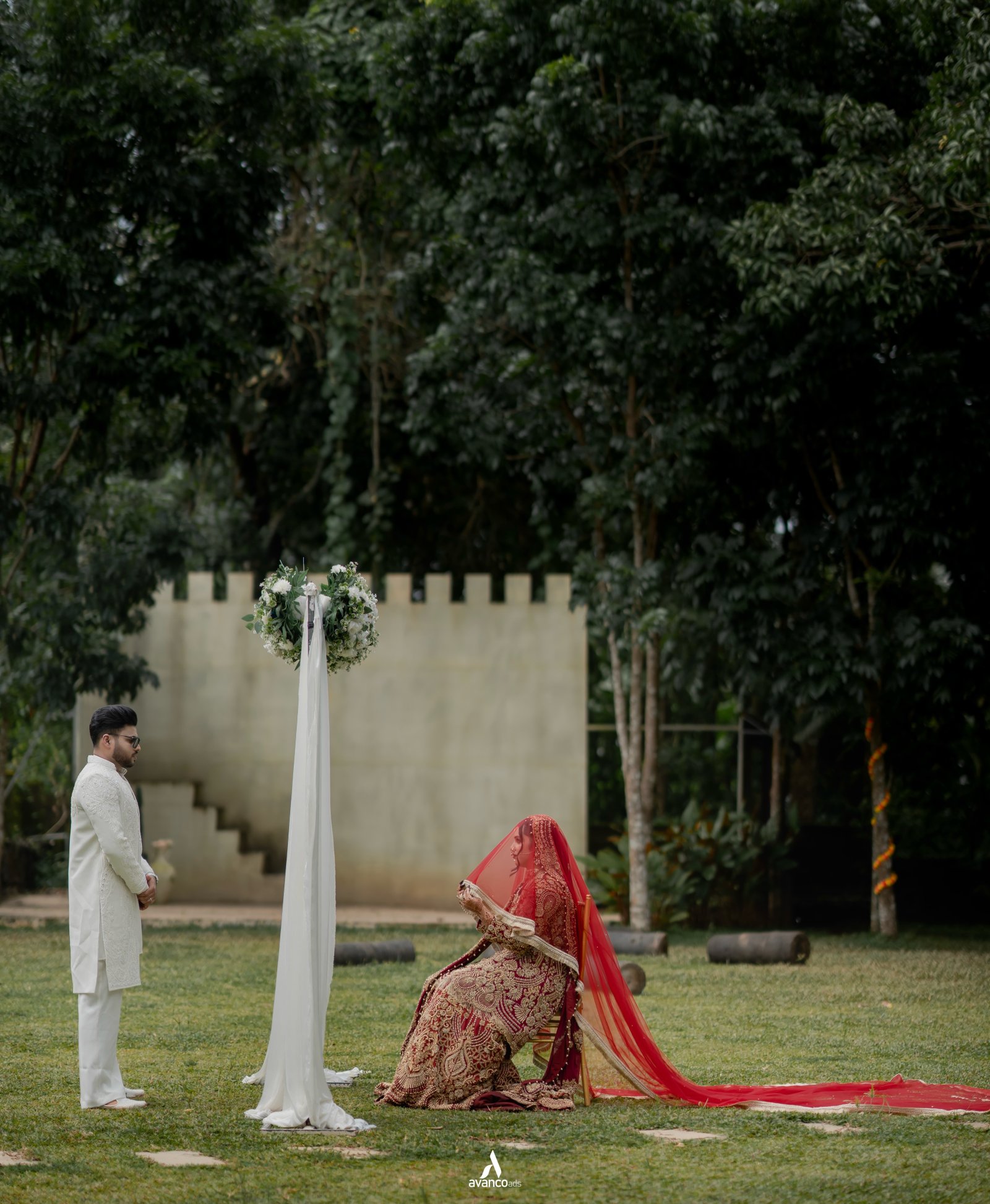 A bride and groom meeting at an outdoor ceremony